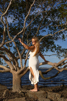 Side angle of Zokkibee Bianca cotton dress with fitted knitted silhouette