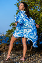 Side angle of Zokkibee Magic Garden linen shirt dress highlighting shirt collar and easy fit