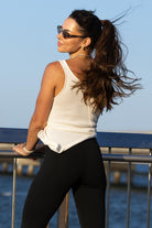 Back view of Zokkibee Molinier white rayon knitted tank top with side clip that tightens the waist section.