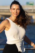 Front view of Zokkibee Molinier white rayon knitted tank top with side clip feature for a cinched waist.