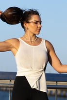 Front view of Zokkibee Molinier white rayon knitted tank top with side clip feature for a cinched waist.