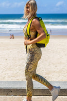 Side angle of Zokkibee tiger leggings and matching crop top highlighting stretch fabric and dynamic design