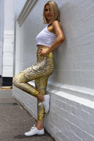 Side angle of Zokkibee tiger leggings highlighting stretch fabric and dynamic design
