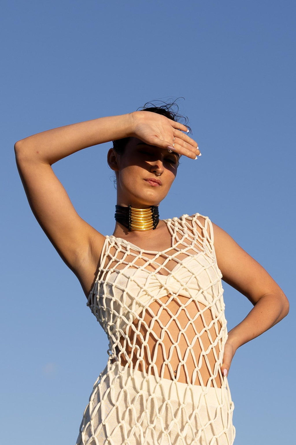 Front view of Zokkibee Asanti choker necklace with leather band and gold plated brass accents