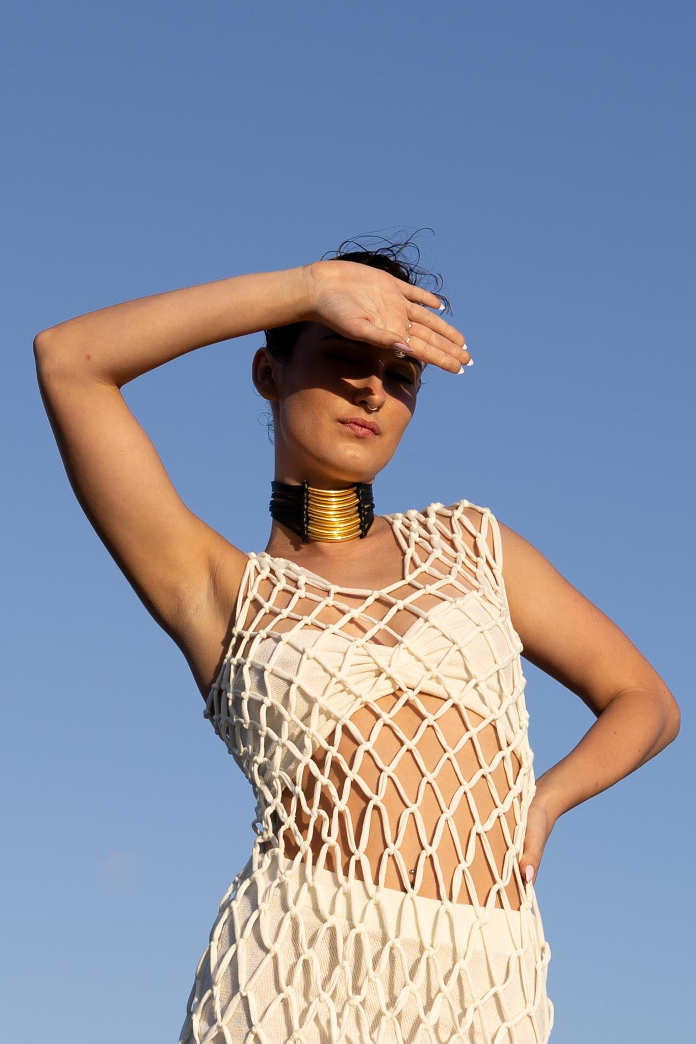 Front view of Zokkibee Asanti choker necklace with leather band and gold plated brass accents