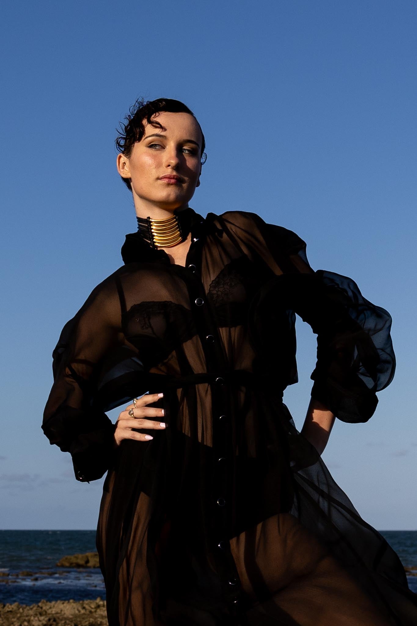 Front view of Zokkibee Asanti choker necklace with leather band and gold plated brass accents