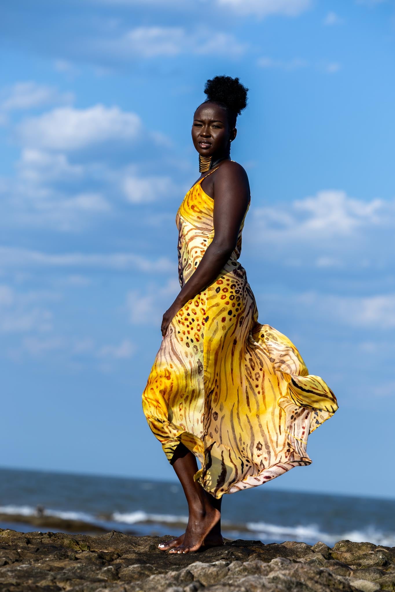 Side angle of Zokkibee Asanti choker necklace with layered leather and gold plated brass detail