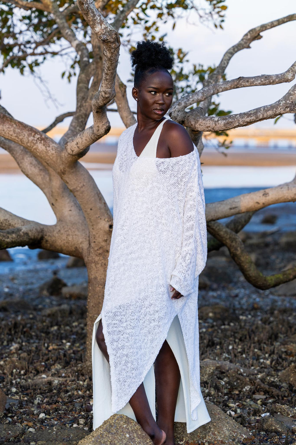 Model wearing Zokkibee asymmetric knitted top with unique asymmetric cut styled for modern, chic fashion