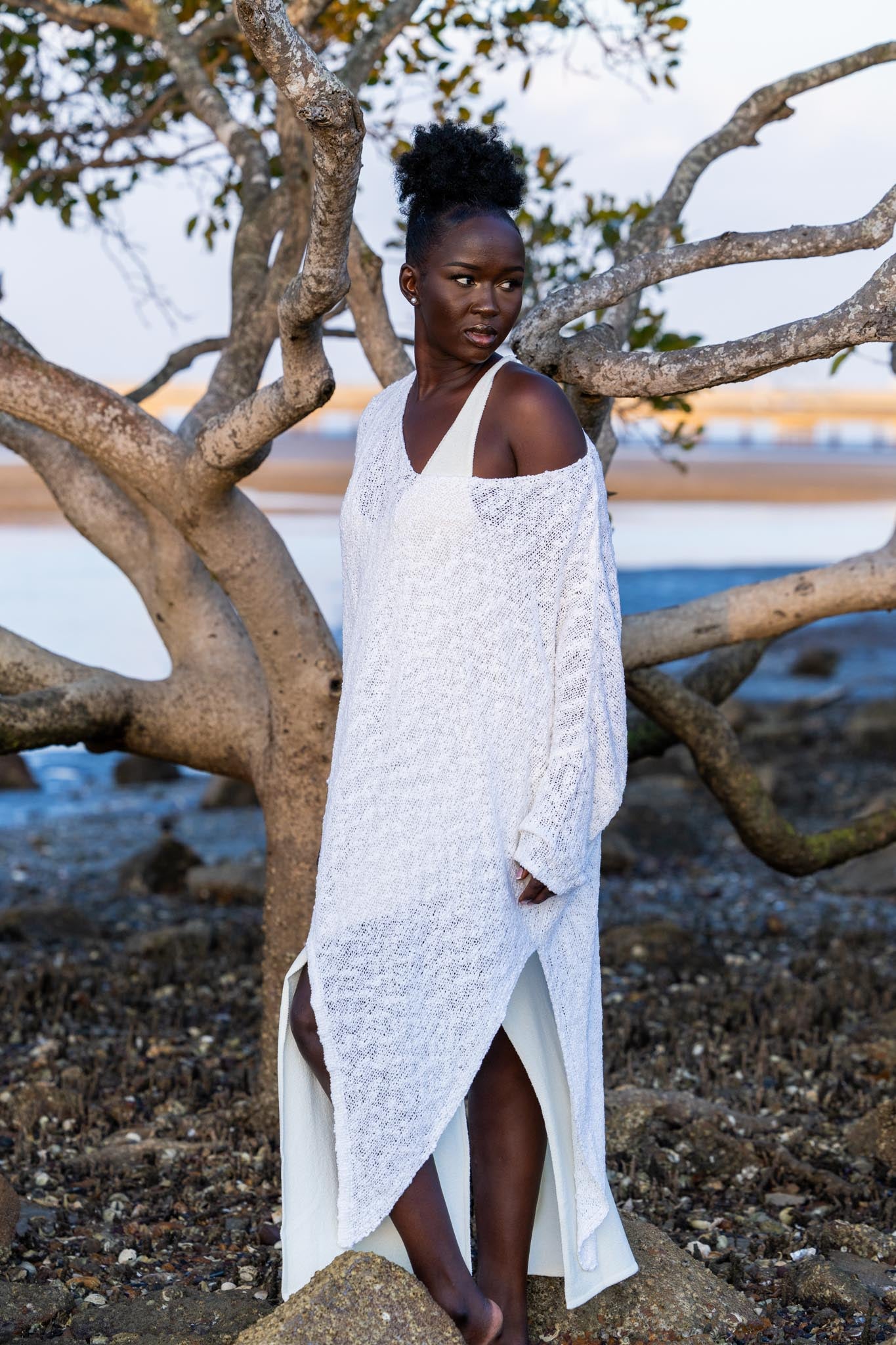 Model wearing Zokkibee asymmetric knitted top with unique asymmetric cut styled for modern, chic fashion