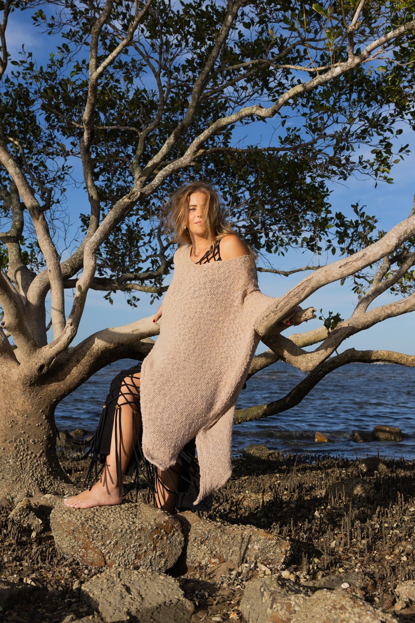 Front view of Zokkibee asymmetric knitted top with unique asymmetric cut and textured knit