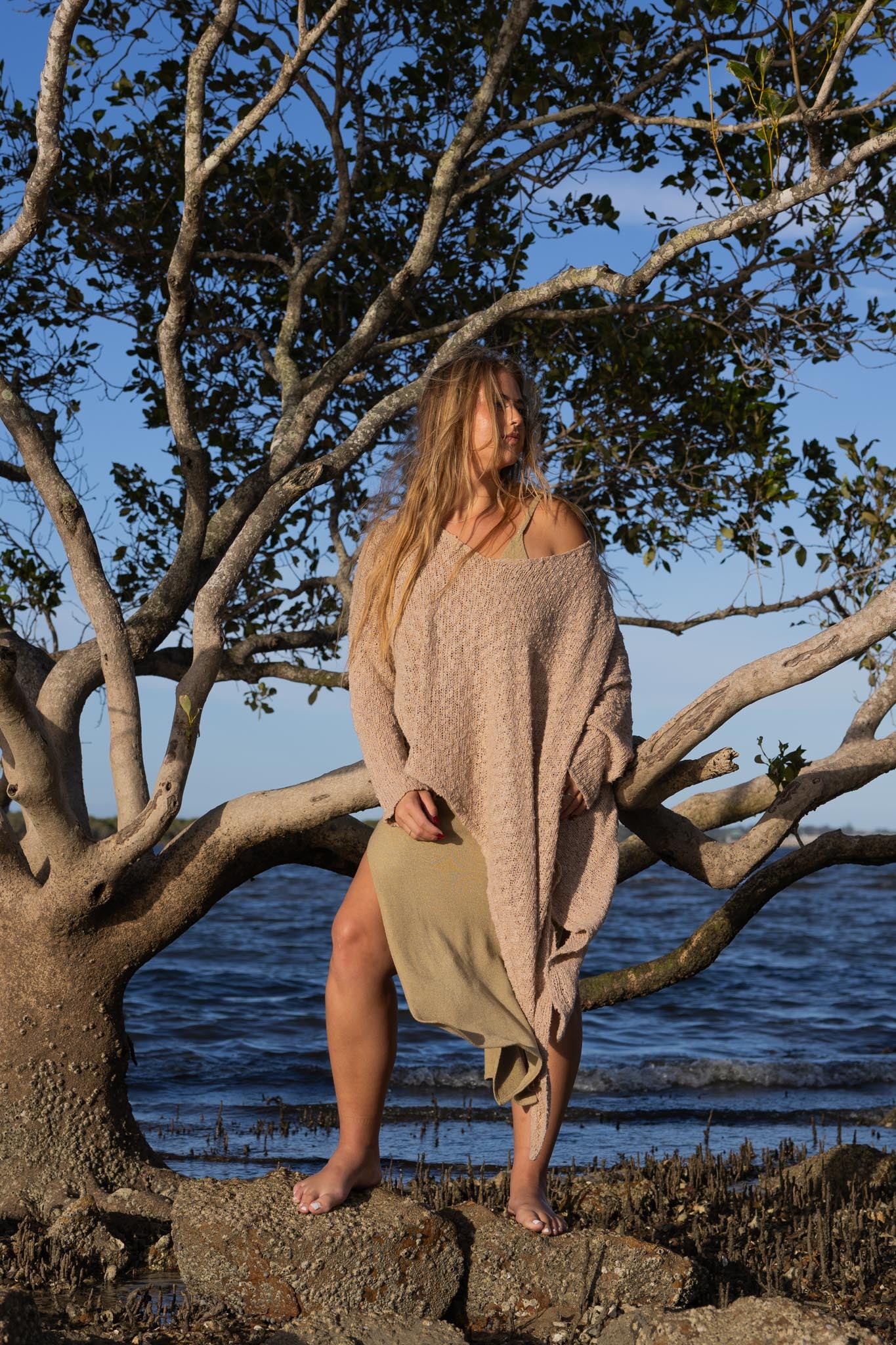 Front view of Zokkibee asymmetric knitted top with unique asymmetric cut and textured knit