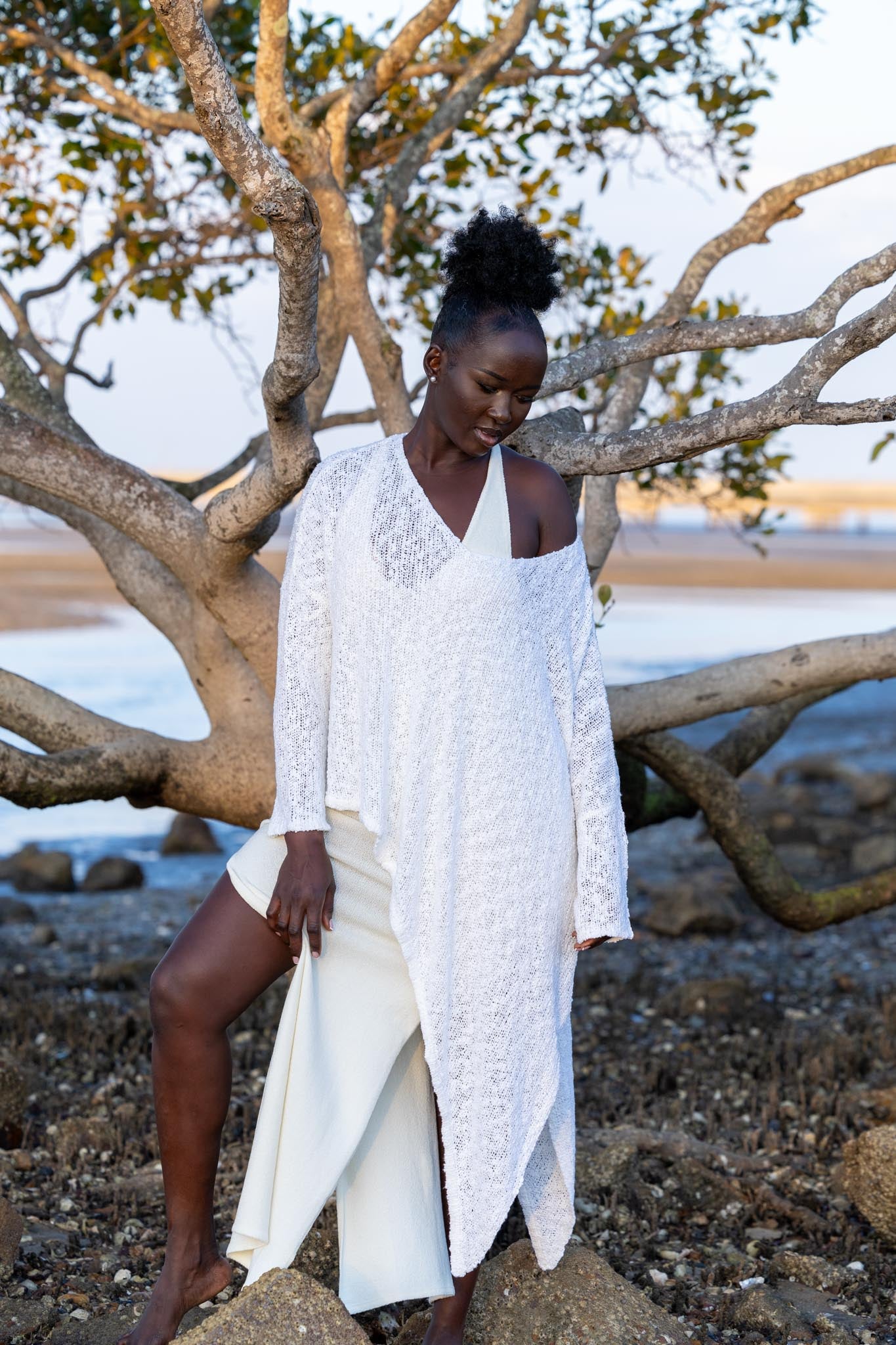 Front view of Zokkibee asymmetric knitted top with unique asymmetric cut and textured knit