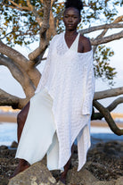 Front view of Zokkibee asymmetric knitted top with unique asymmetric cut and textured knit