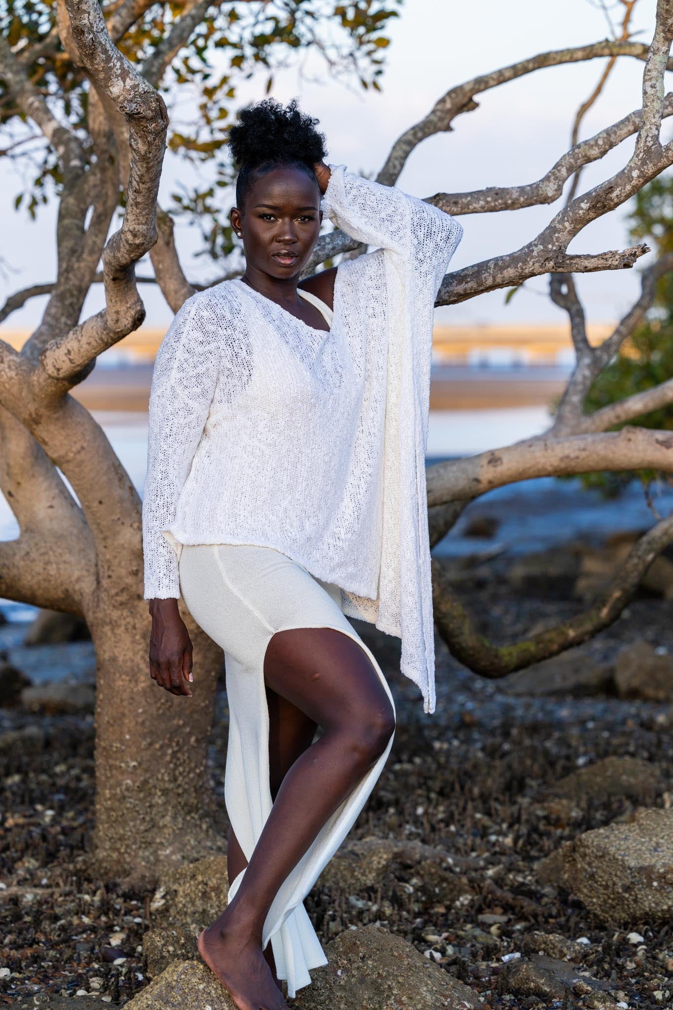 Front view of Zokkibee asymmetric knitted top with unique asymmetric cut and textured knit