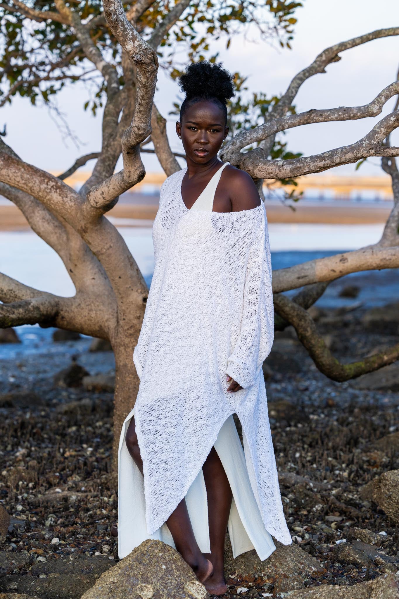 Front view of Zokkibee asymmetric knitted top with unique asymmetric cut and textured knit