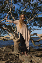 Model wearing Zokkibee asymmetric knitted top with unique asymmetric cut styled for modern, chic fashion