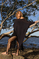 Model wearing Zokkibee asymmetric knitted top with unique asymmetric cut styled for modern, chic fashion