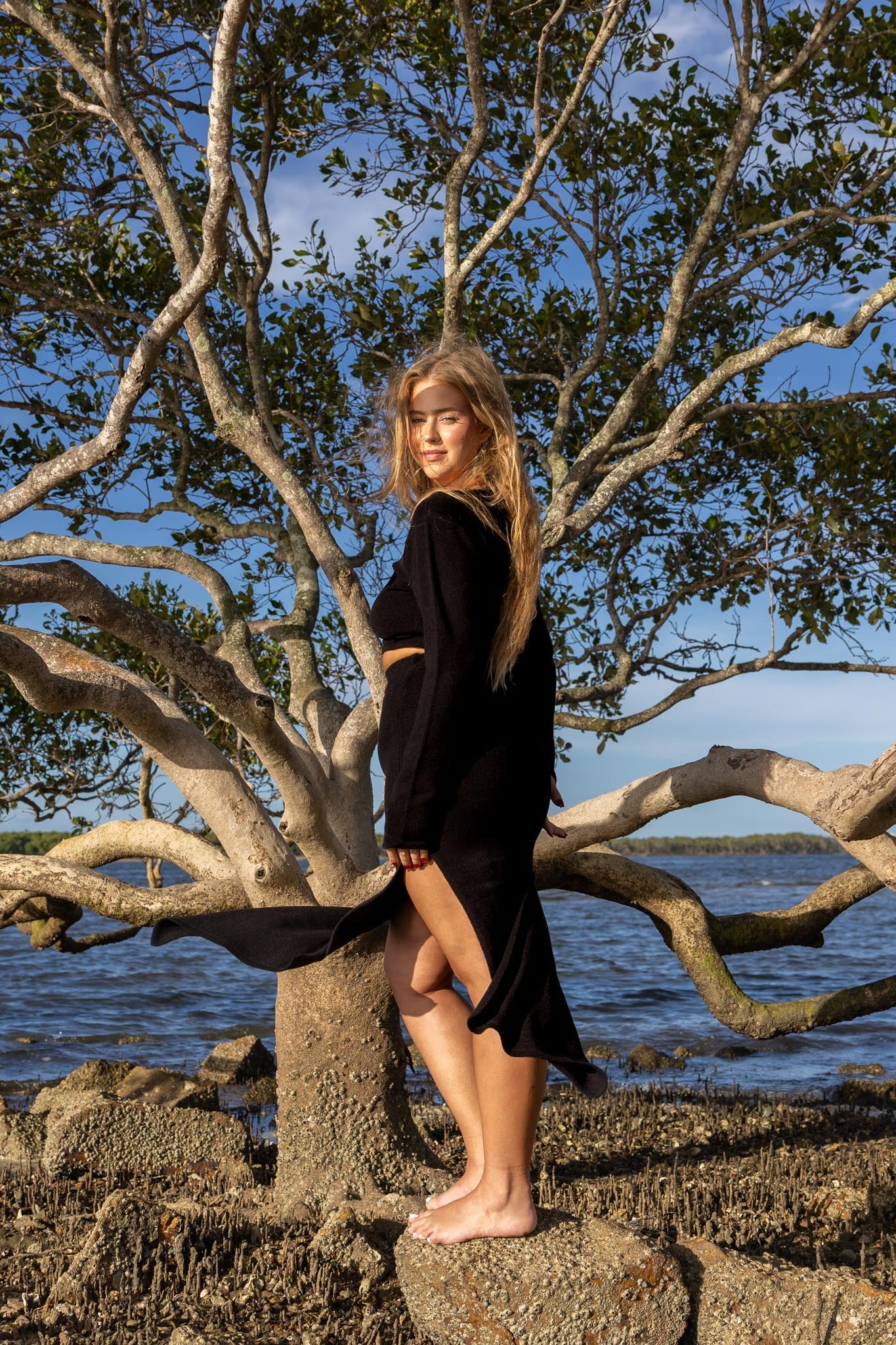 Side angle of Zokkibee Bella long sleeve crop top in cotton with modern cropped fit