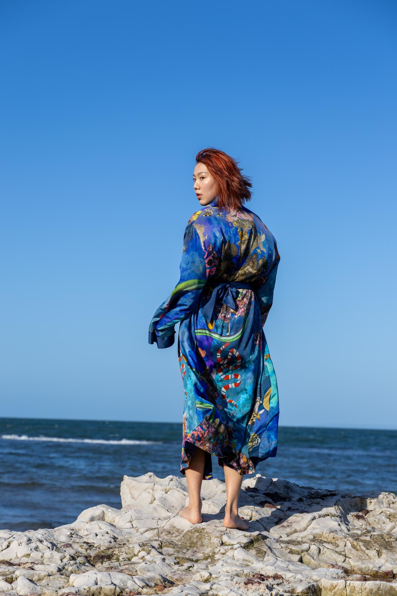 Back view of Birth of Venus kimono showing detailed artwork and elegant drape