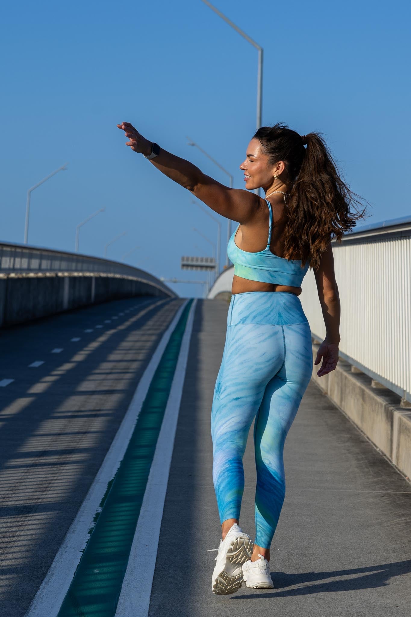 Back view of blue tiger leggings and crop set showing all-over blue tiger print and fitted silhouette