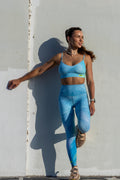 Model wearing Zokkibee blue tiger leggings and matching crop top styled for modern, active fashion