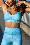 Model wearing Zokkibee blue tiger leggings and matching crop top styled for modern, active fashion