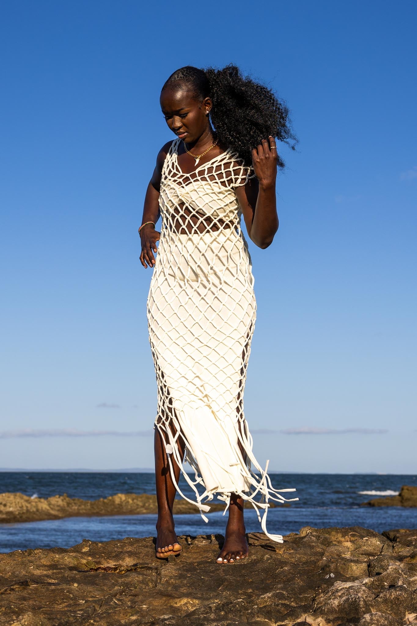 Front view of Zokkibee Inka Diamond fringe dress with artisan macramé knots and long fringe