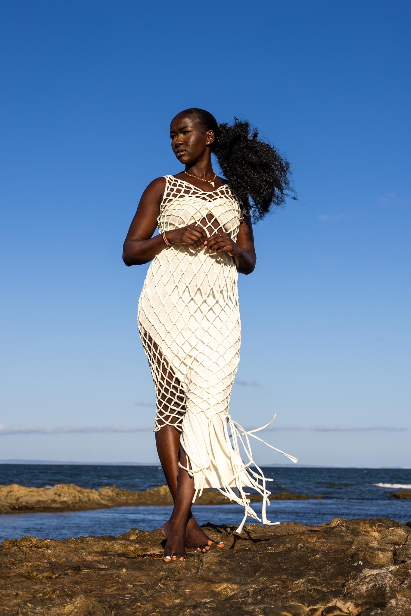 Front view of Zokkibee Inka Diamond fringe dress with artisan macramé knots and long fringe