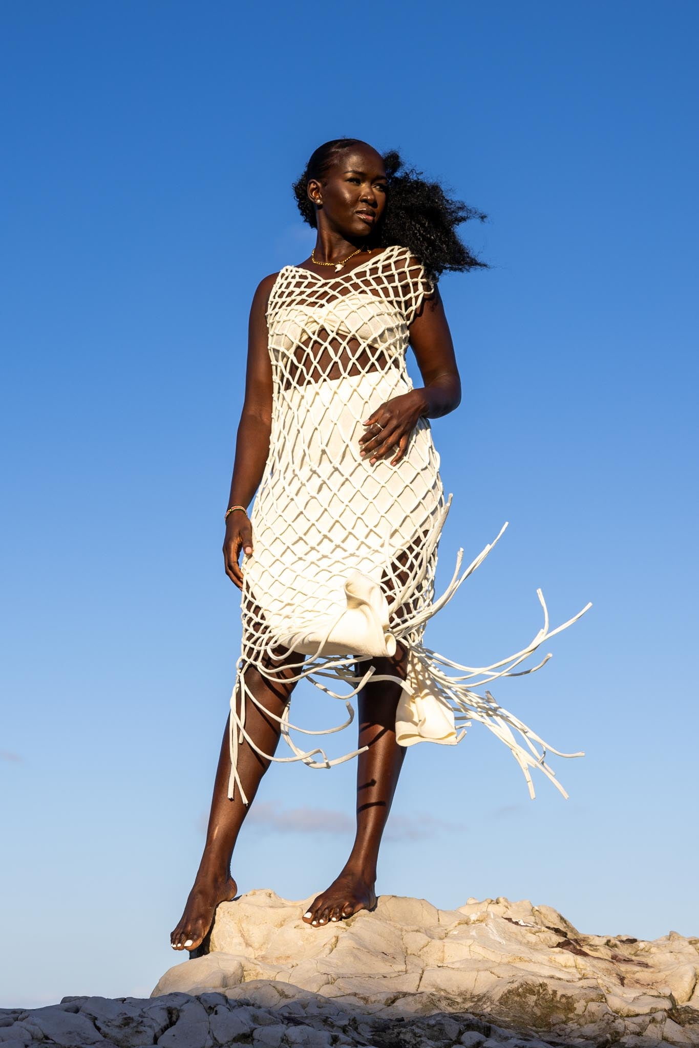 Front view of Zokkibee Inka Diamond fringe dress with artisan macramé knots and long fringe
