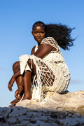 Side view of Zokkibee Inka Diamond fringe dress with artisan macramé knots and long fringe