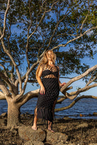 Front view of Zokkibee Inka Obsidian fringe dress in black with artisan macramé knots and dramatic fringe.