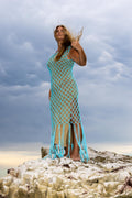 Side angle of Inka Sapphire blue fringe dress by Zokkibee with macramé knotwork and dramatic fringe.