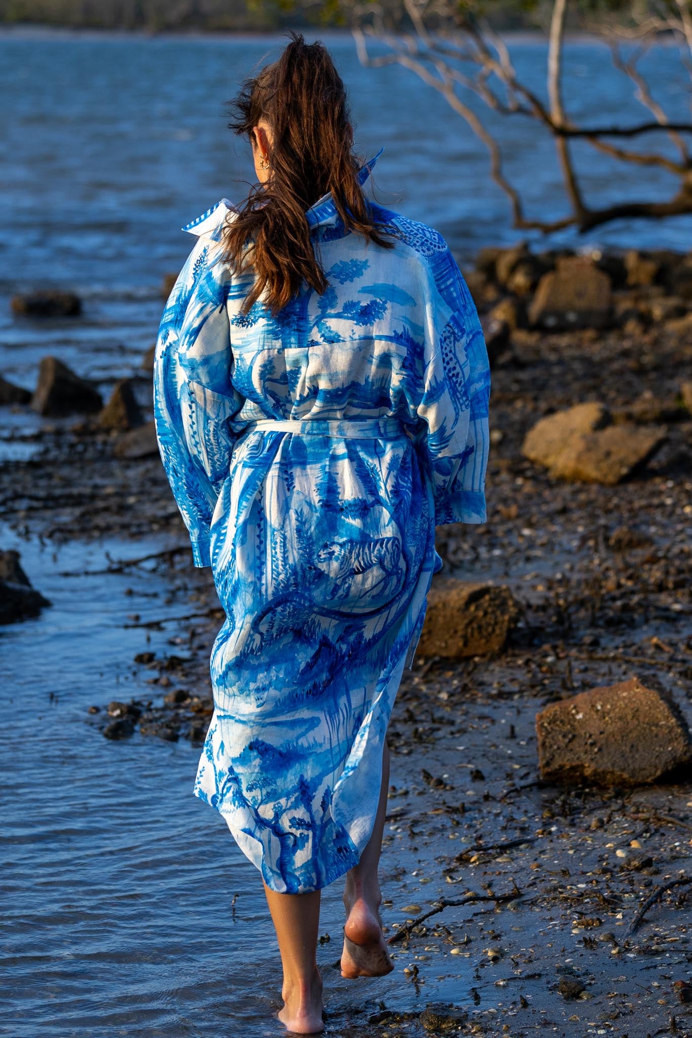 Back view of Magic Garden linen shirt dress showing flowing silhouette and natural linen fabric