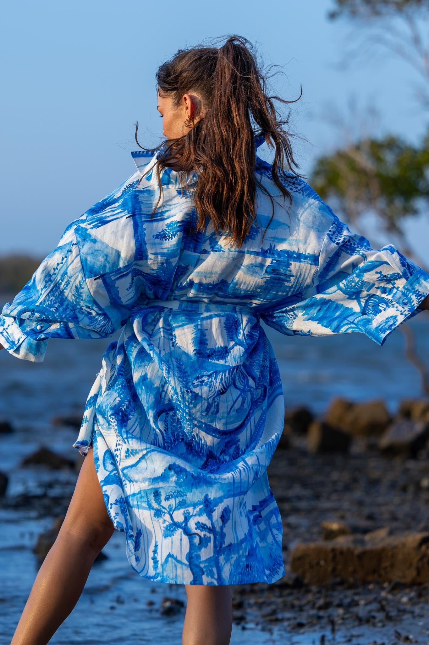 Back view of Magic Garden linen shirt dress showing flowing silhouette and natural linen fabric