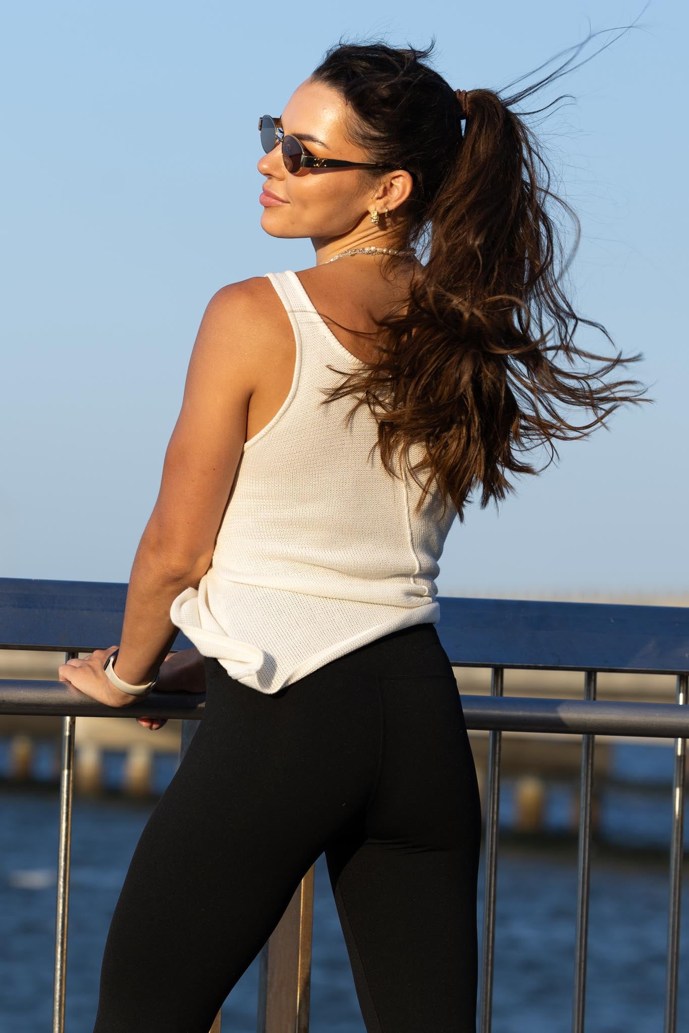 Back view of Zokkibee Molinier white rayon knitted tank top with side clip that tightens the waist section.