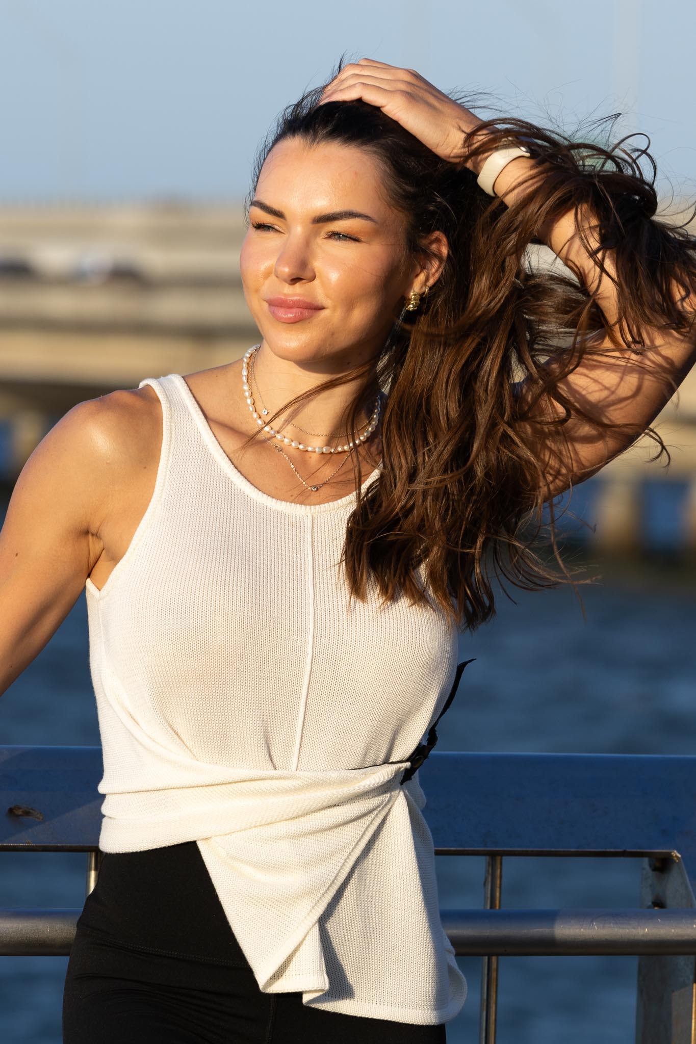 Front view of Zokkibee Molinier white rayon knitted tank top with side clip feature for a cinched waist.