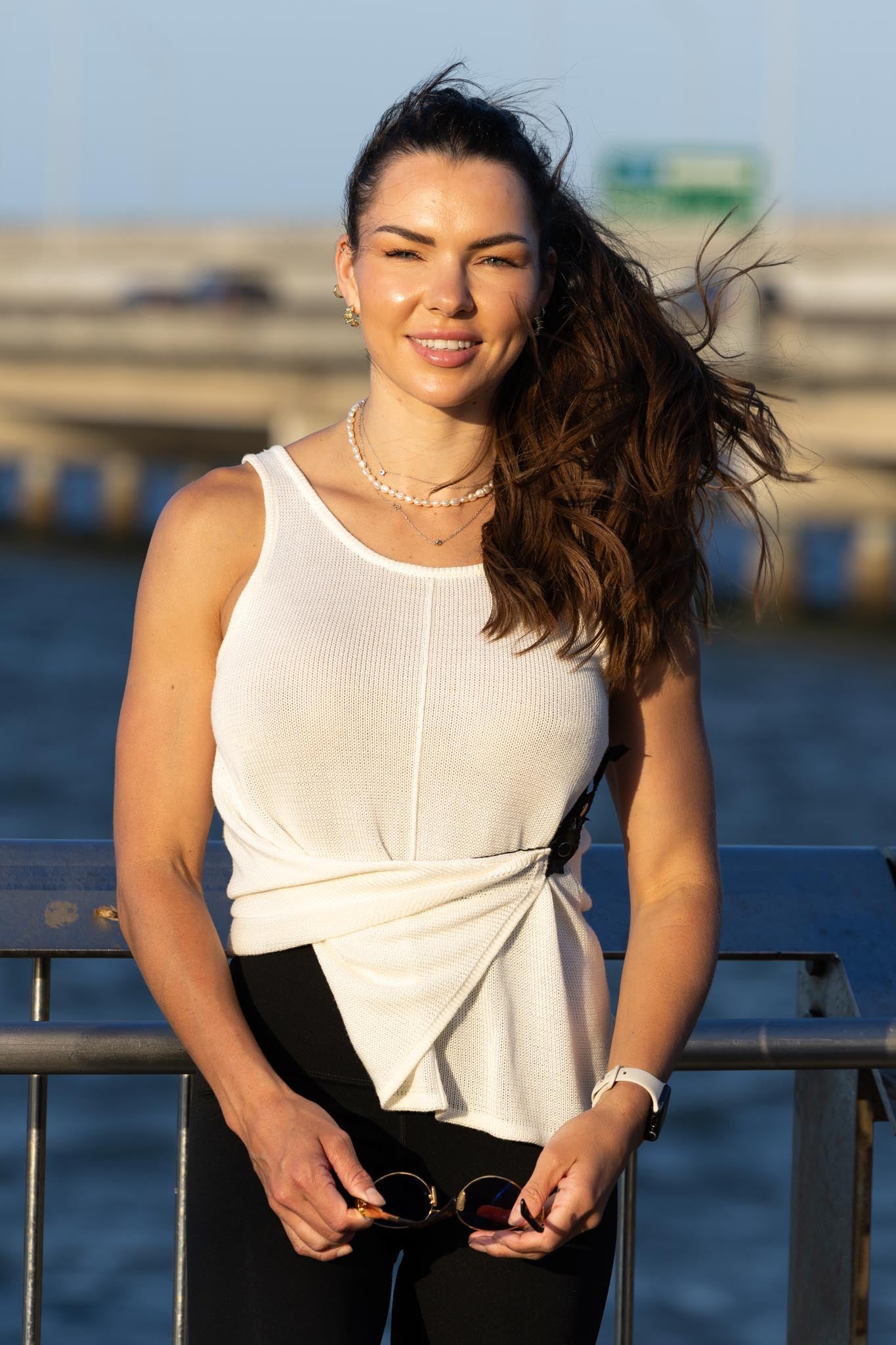 Front view of Zokkibee Molinier white rayon knitted tank top with side clip feature for a cinched waist.