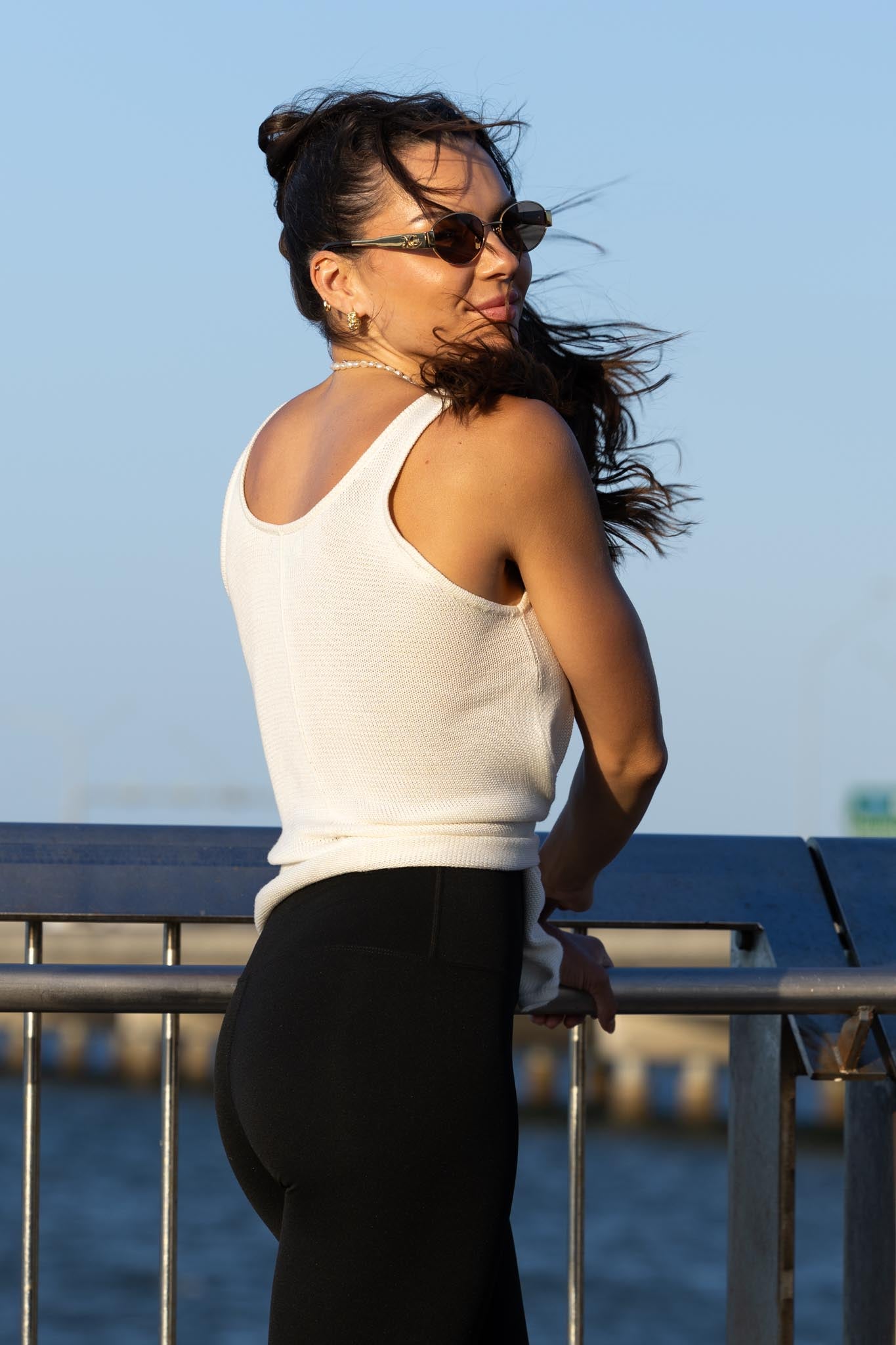 Back view of Zokkibee Molinier white rayon knitted tank top with side clip that tightens the waist section.