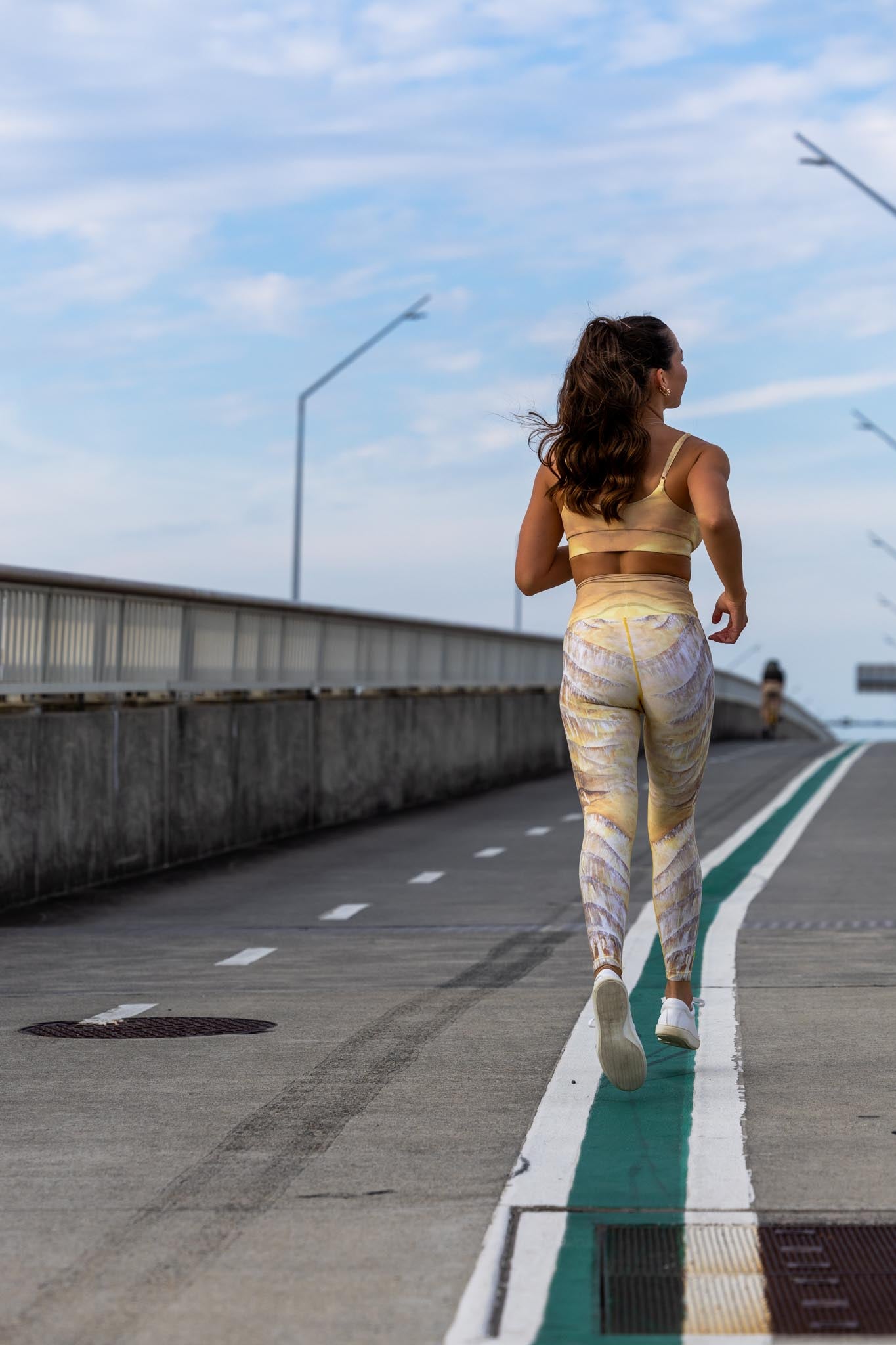 Back view of Nomad leggings and crop set showing all-over print and fitted silhouette