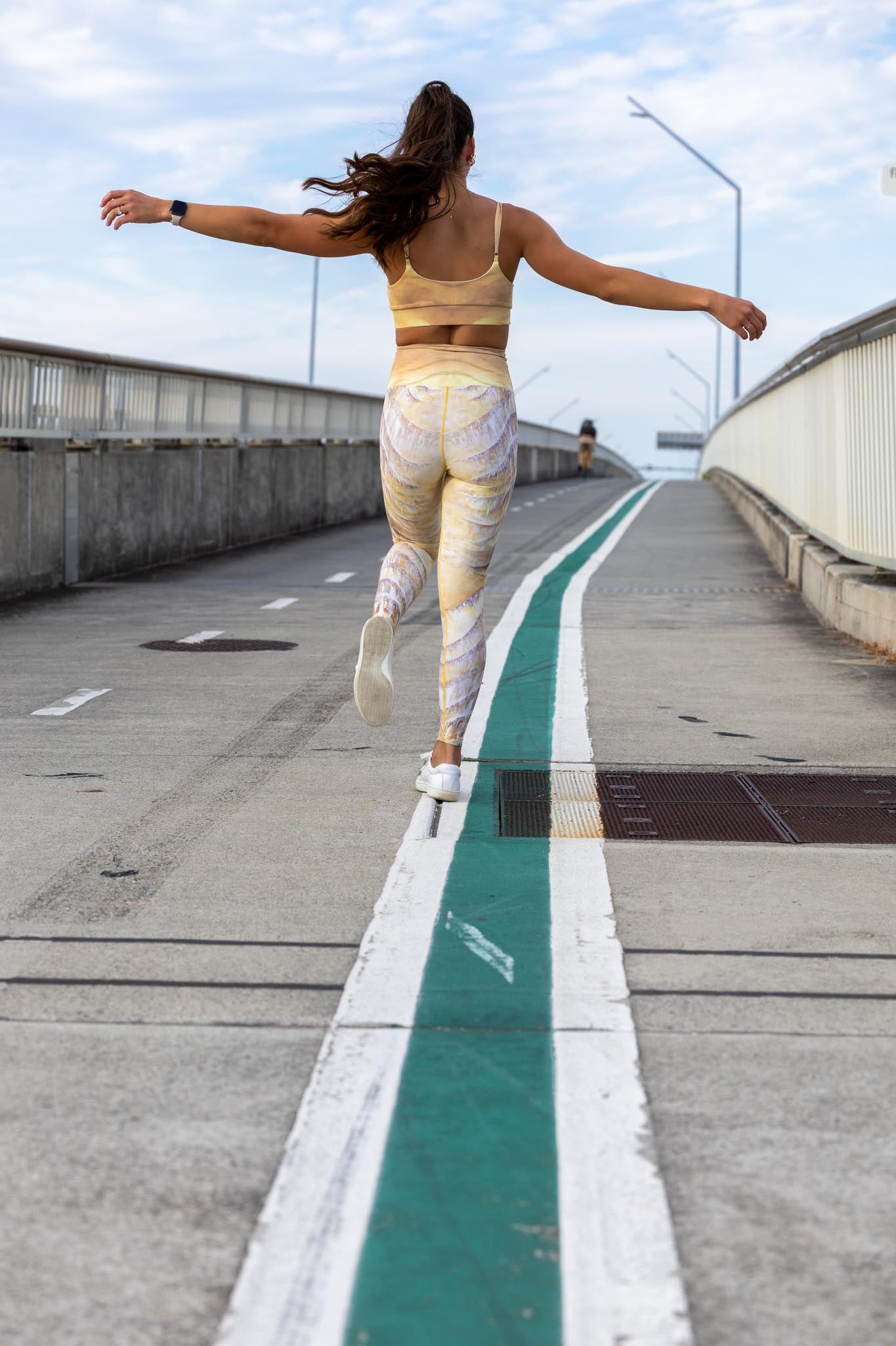 Back view of Nomad leggings and crop set showing all-over print and fitted silhouette