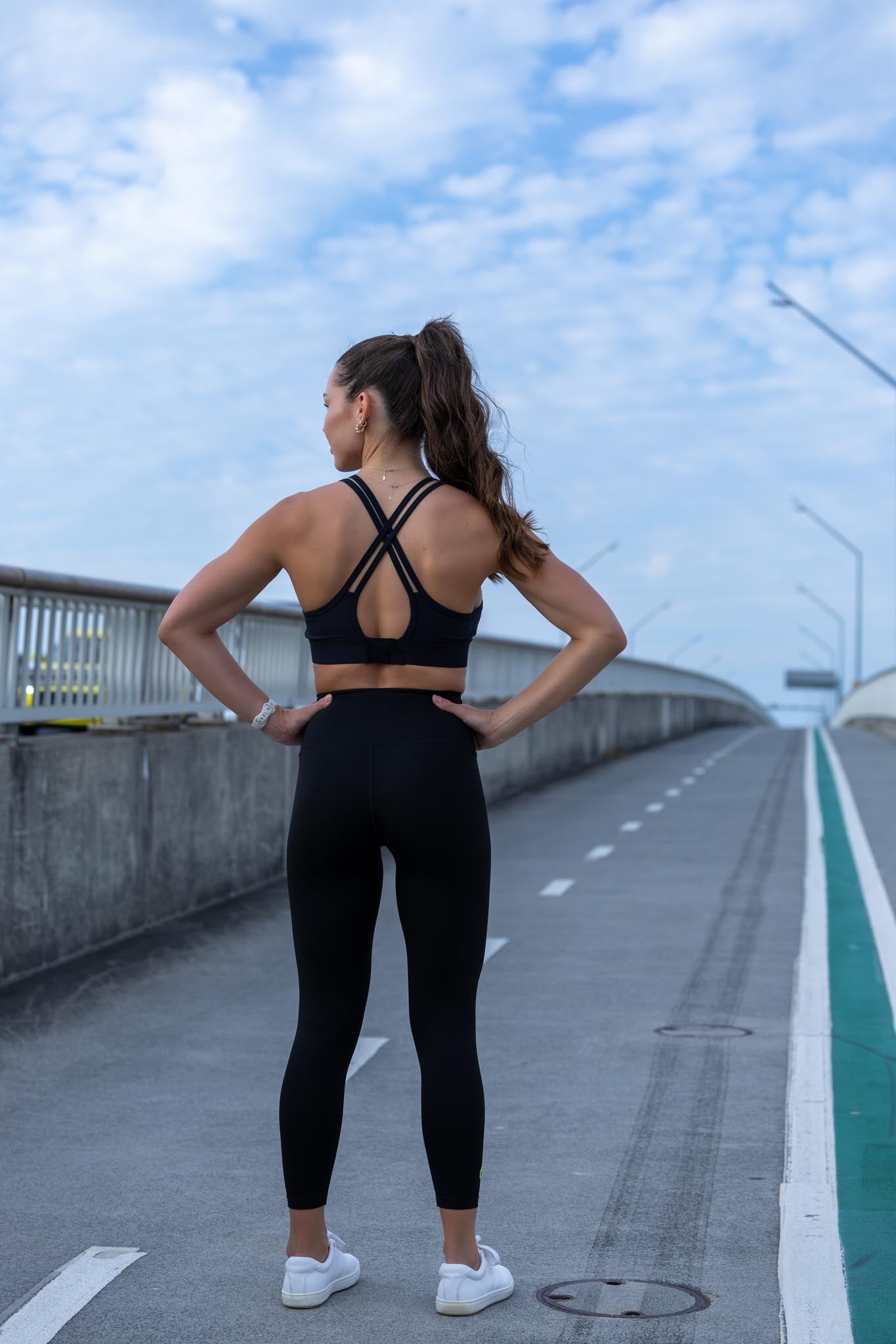 Back view of Onyx crop top and leggings set showing fitted silhouette and sleek black design