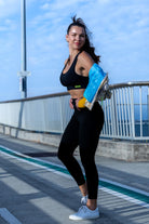 Side angle of Zokkibee Onyx crop top and leggings set highlighting stretch fabric and streamlined style
