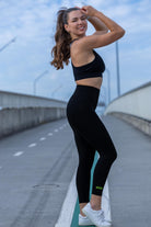 Side angle of Zokkibee Onyx crop top and leggings set highlighting stretch fabric and streamlined style