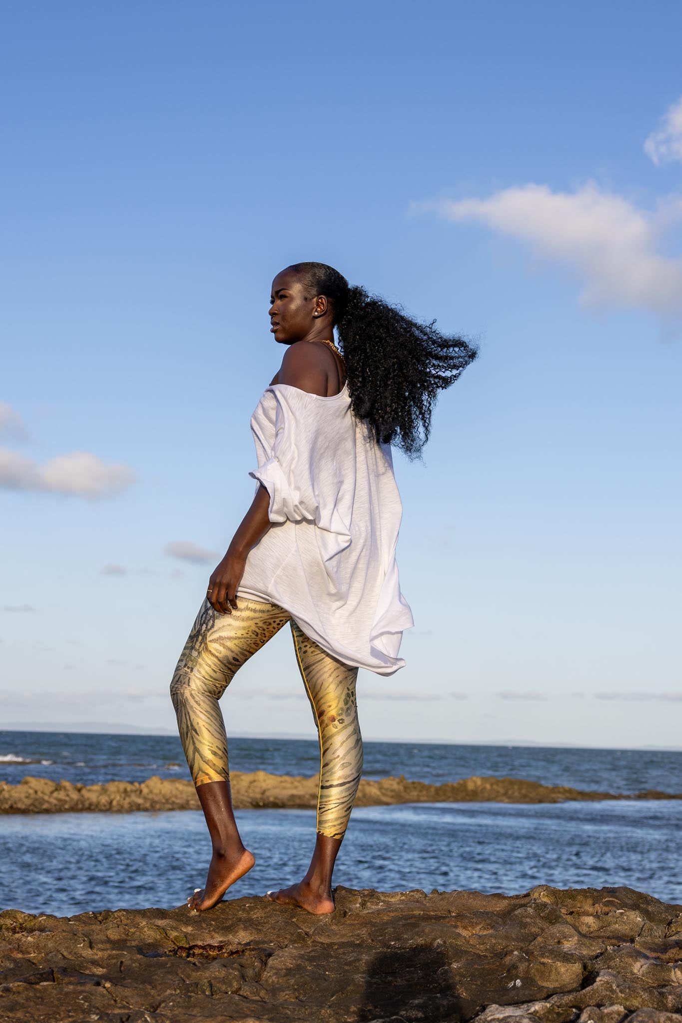 Side angle of Zokkibee oversized t-shirt highlighting dropped shoulders and casual style
