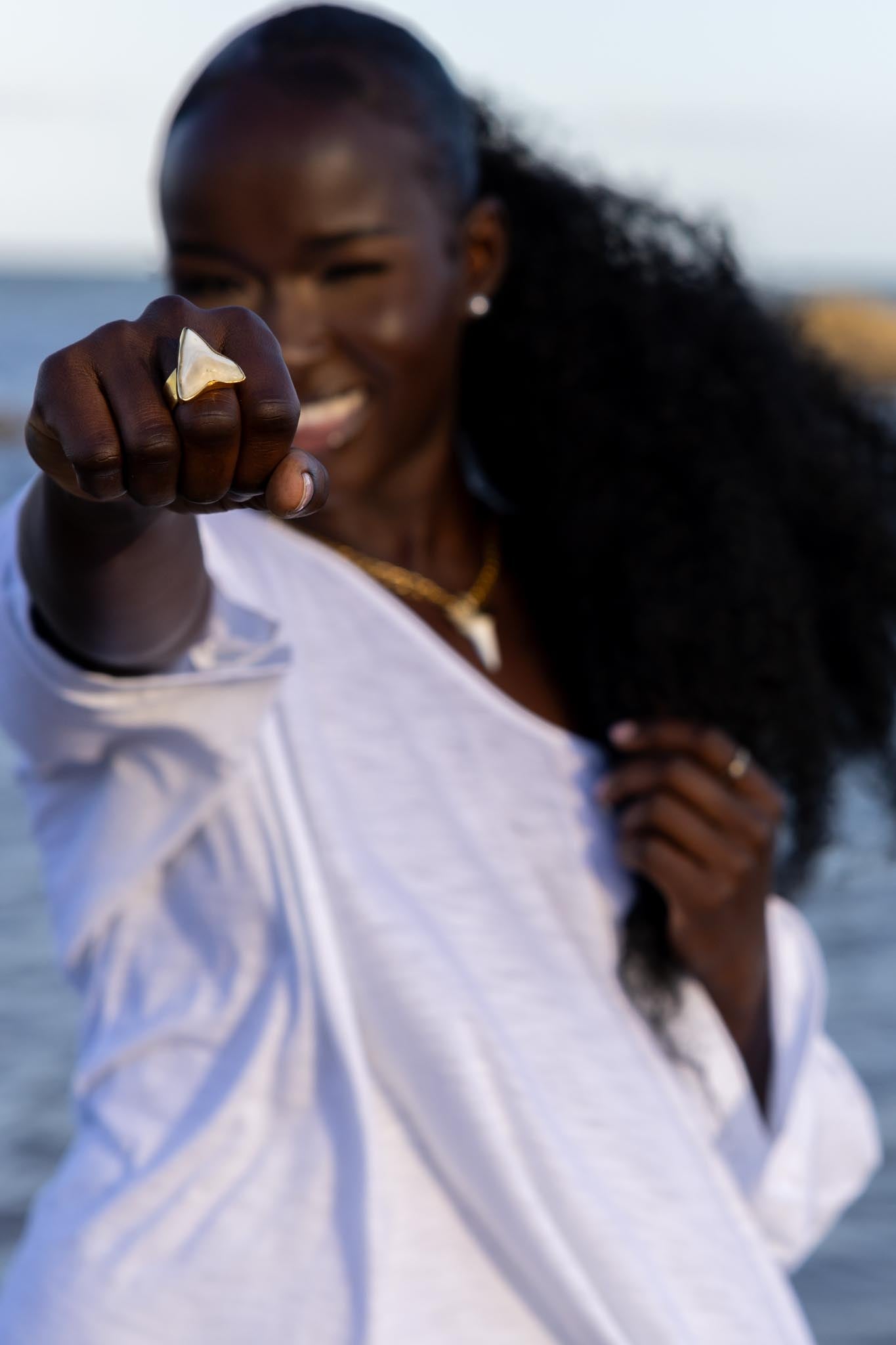 Model wearing Zokkibee shark tooth ring styled for modern, bold fashion