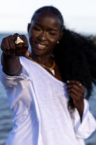 Front view of Zokkibee shark tooth ring with natural shark tooth set on finger band