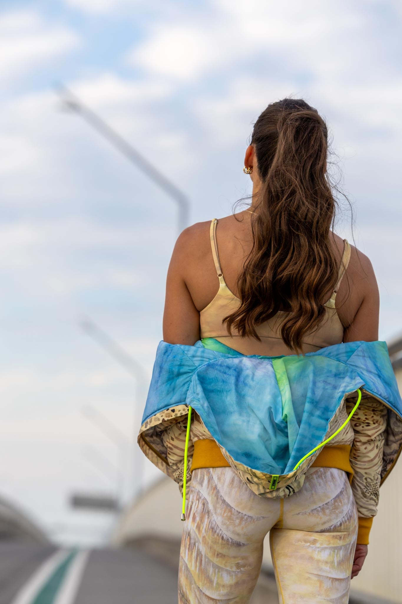 Back view of tiger jacket showing all-over tiger design and tailored cut