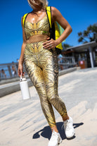 Model wearing Zokkibee tiger leggings and matching crop top styled for active or statement fashion