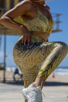 Side angle of Zokkibee tiger leggings and matching crop top highlighting stretch fabric and dynamic design