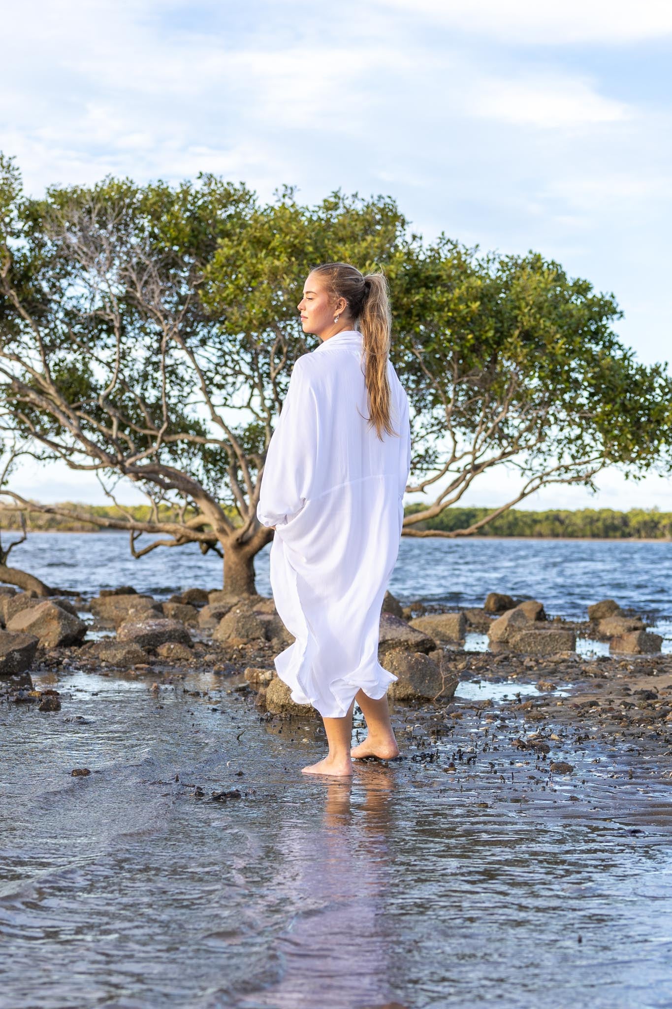 Back view of Vacanza dress showing oversized silhouette and loose fit